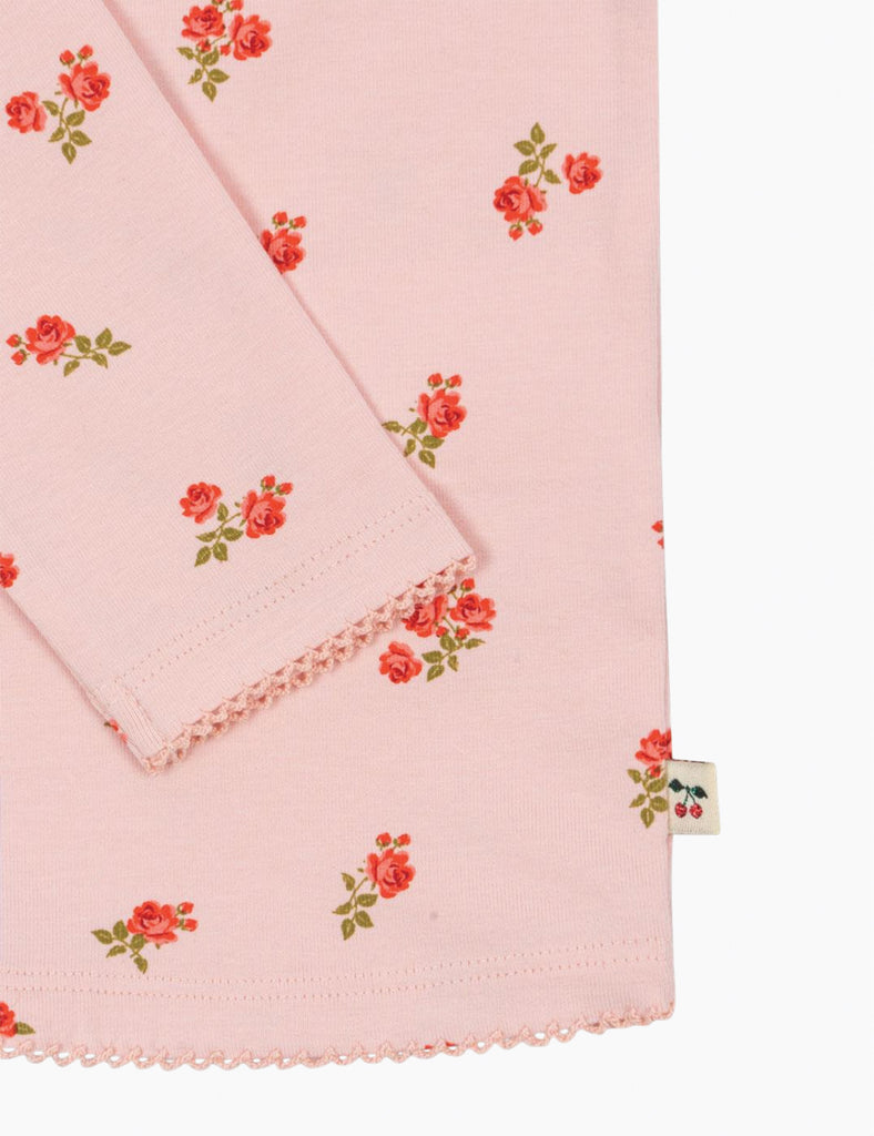 Pink fabric with floral pattern on a white background