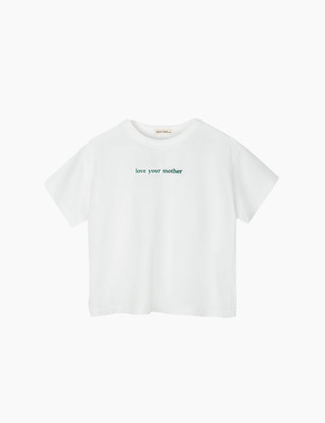 White t-shirt with 'love your mother' text on a white background
