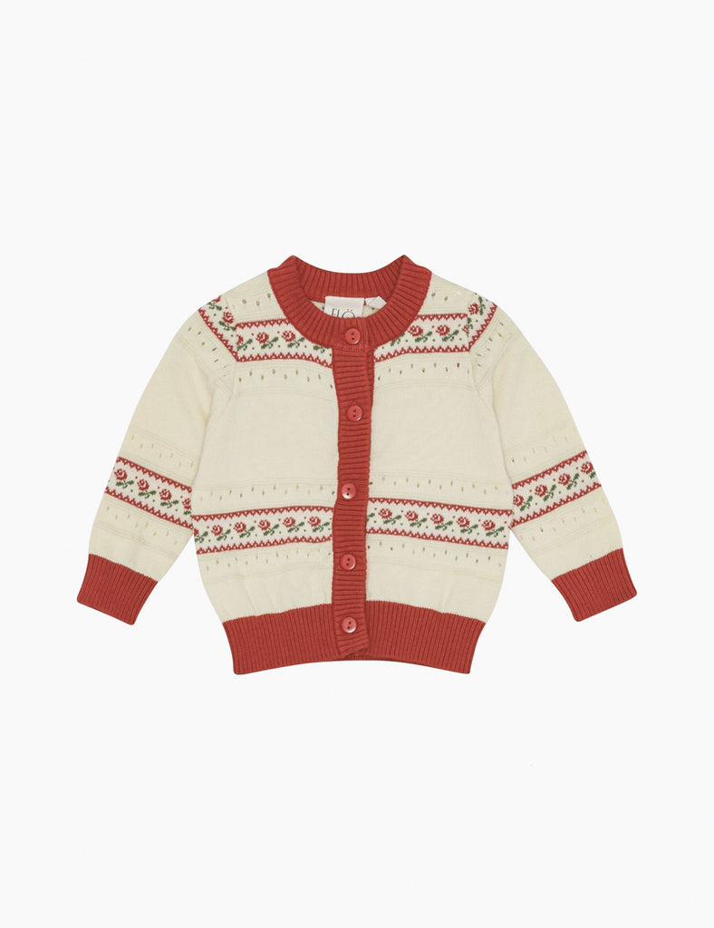 Knitted cardigan with red and white pattern on a white background