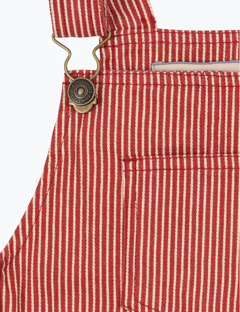 Close-up of red and white striped overalls with a button on a white background