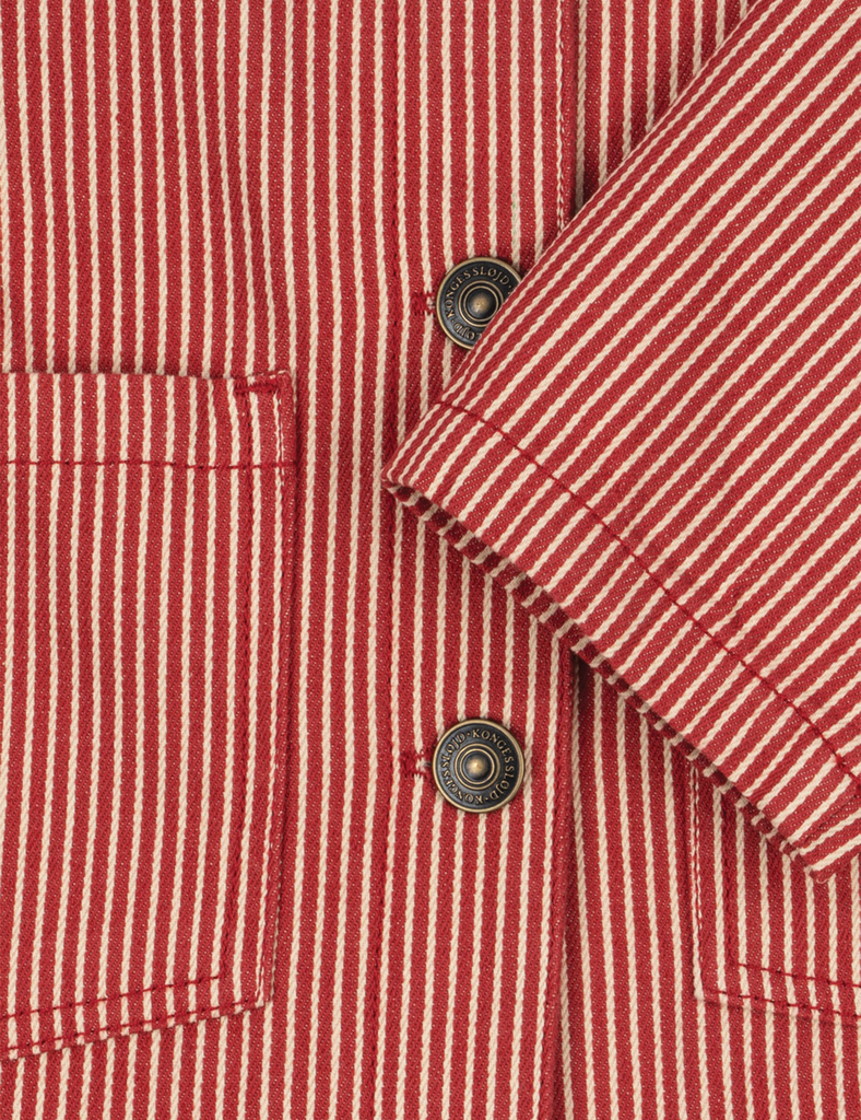 Close-up of a red and white striped shirt with buttons.