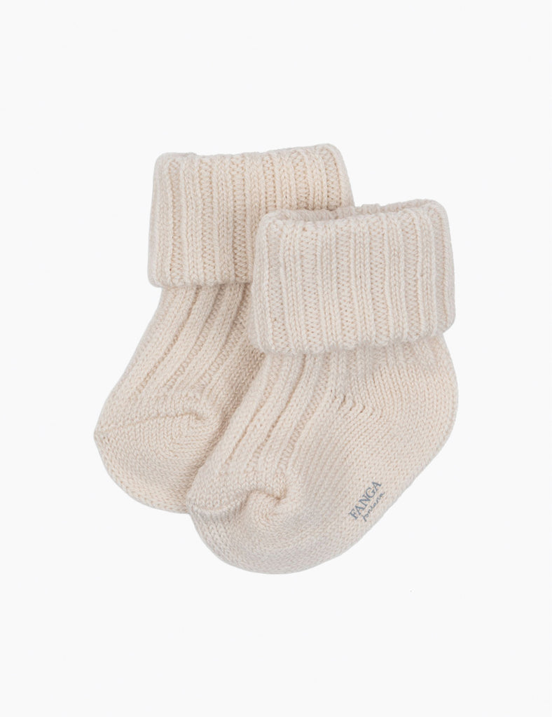Pair of cream baby socks on a white background
