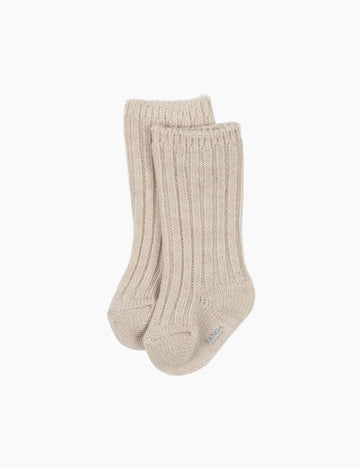Pair of beige socks on a white background