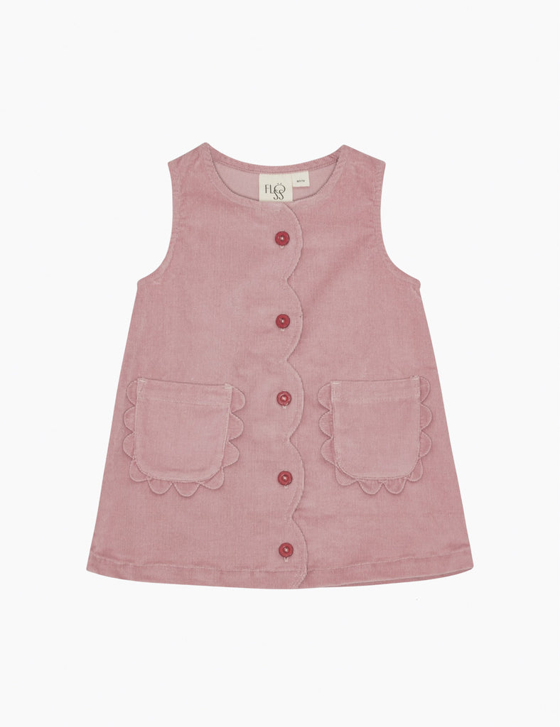 Pink sleeveless dress with buttons and scalloped edges on a white background