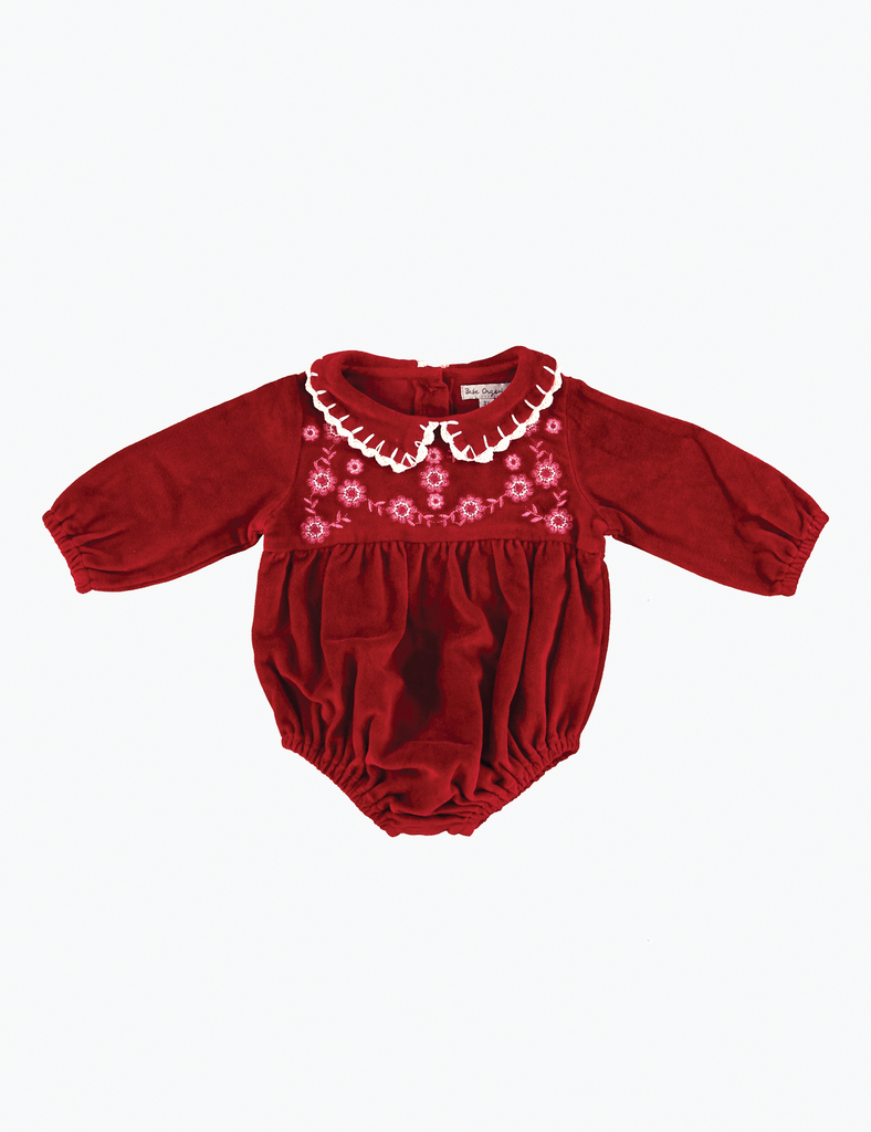Red baby romper with floral embroidery on a white background