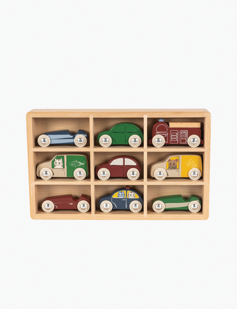Set of wooden toy cars in a display case on a white background