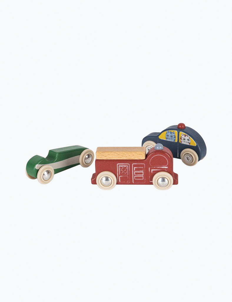 Three wooden toy cars on a white background