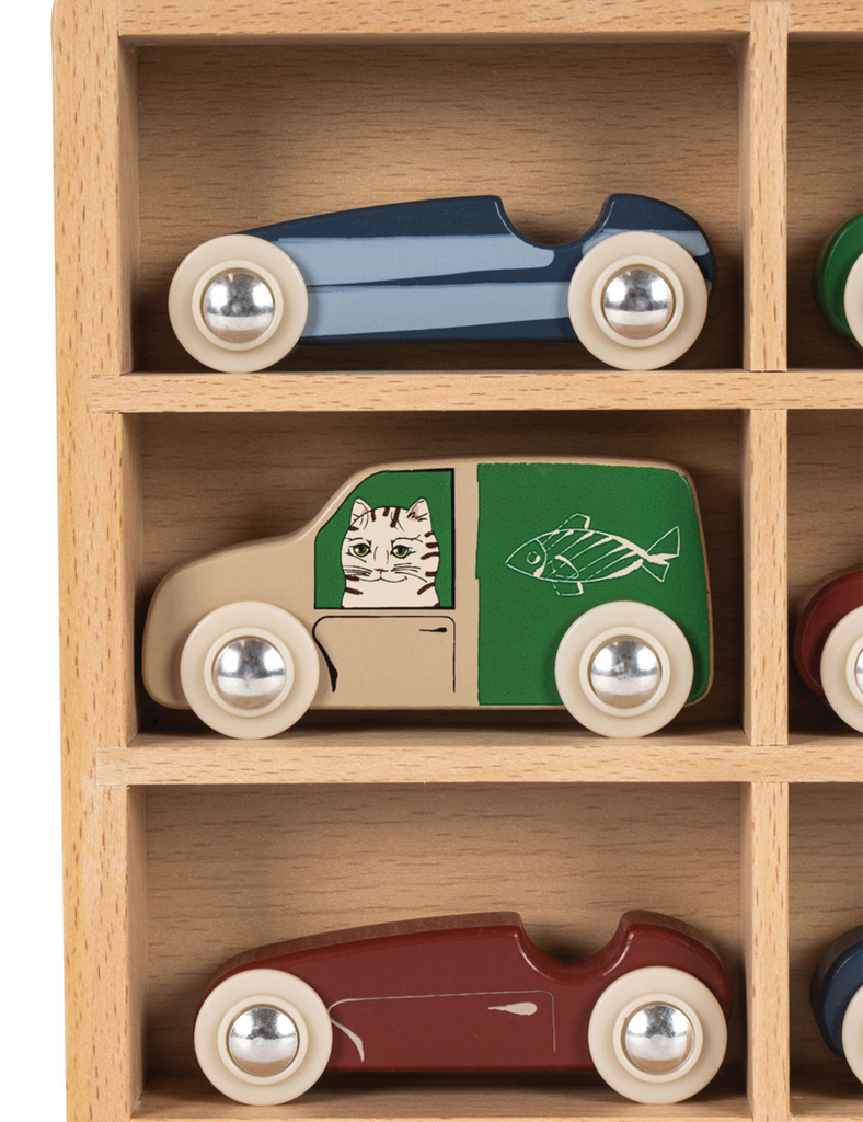 Wooden toy cars on a wooden shelf
