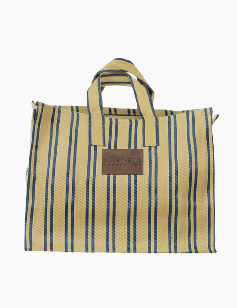 Striped tote bag with a leather patch on a white background