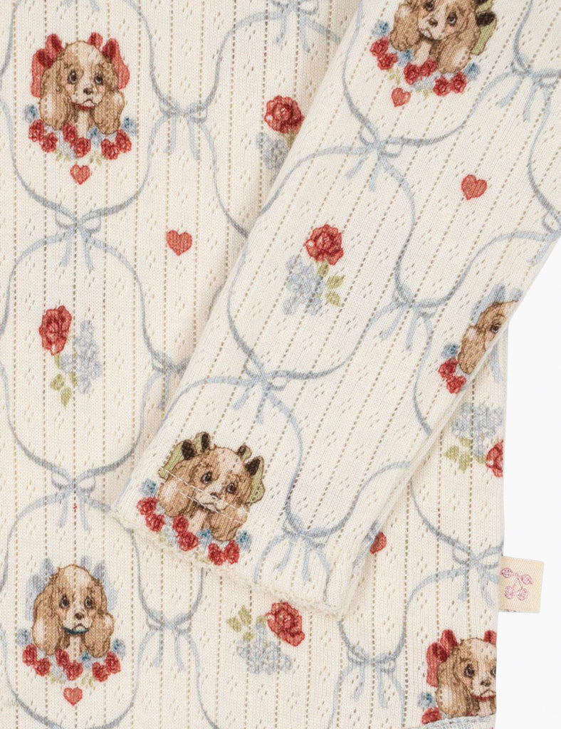 Fabric with dog and rose pattern on a white background