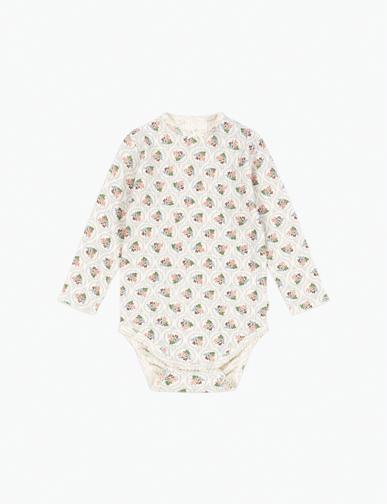 Baby onesie with a pattern on a white background