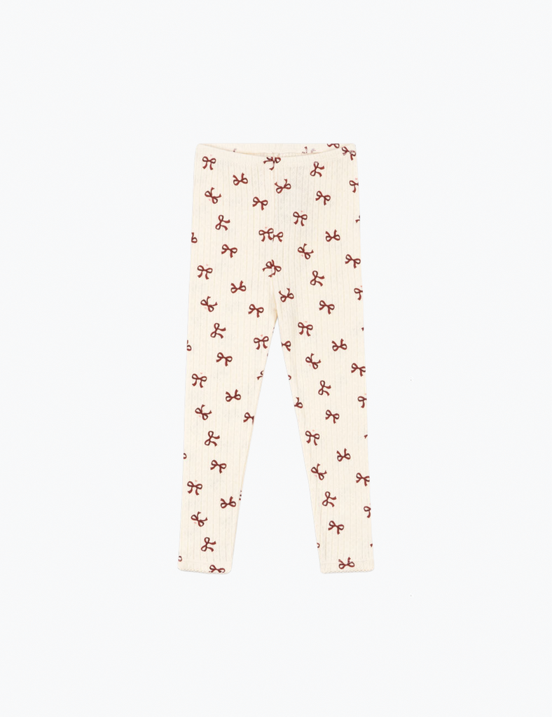 Leggings with a pattern of small shapes on a white background