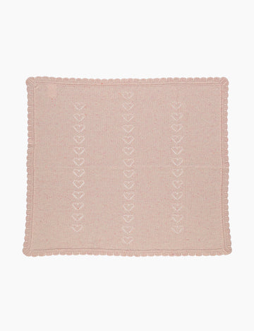 Pink textured fabric with heart pattern on a white background