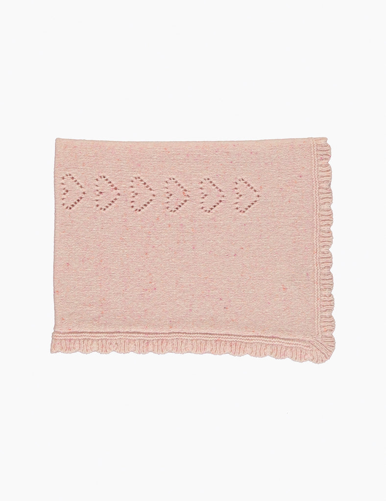 Pink textured blanket with geometric pattern on a white background