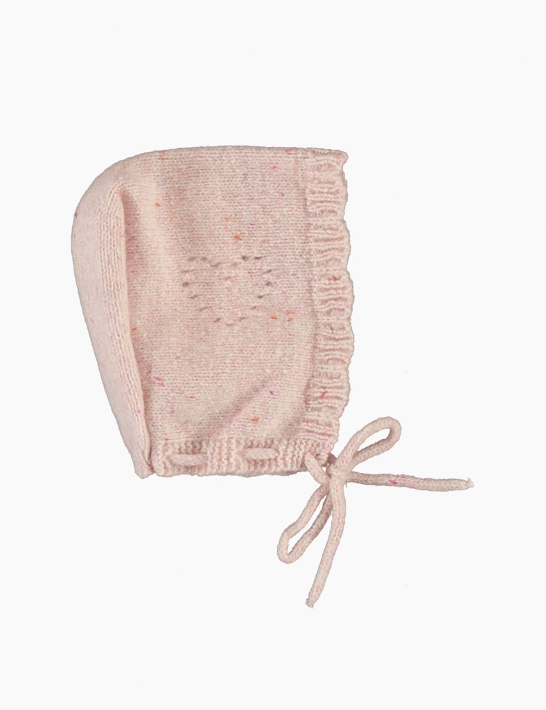 Pink baby bonnet on a white background