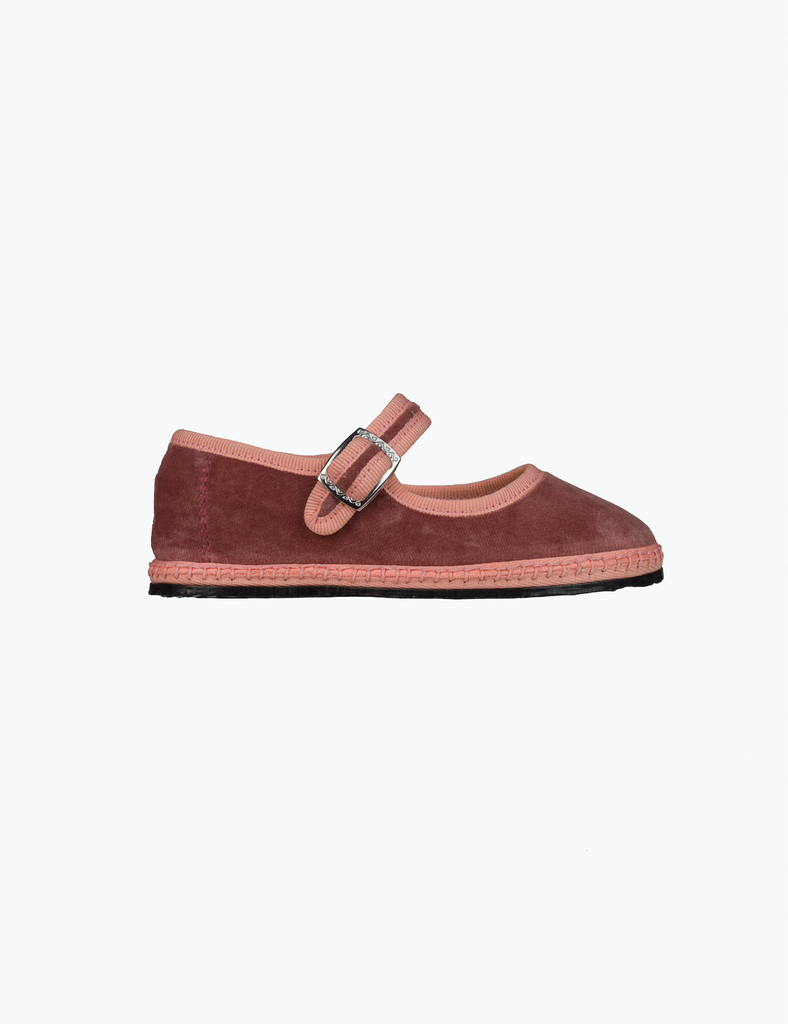Brown shoe with a buckle on a white background