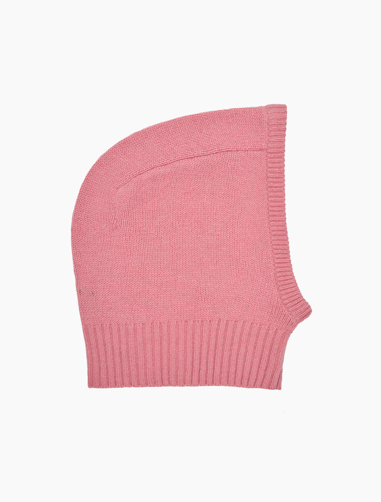 Pink knitted hood on a white background