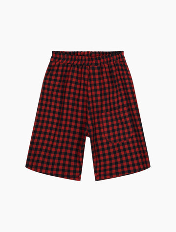 Red and black checkered shorts on a white background