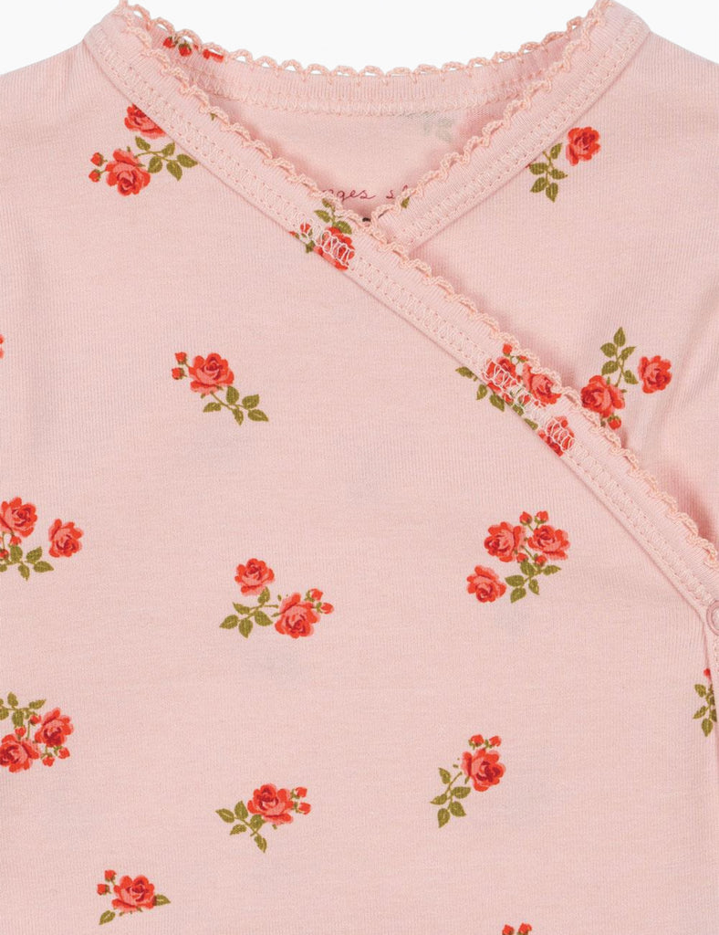 Pink garment with floral pattern on a light pink background