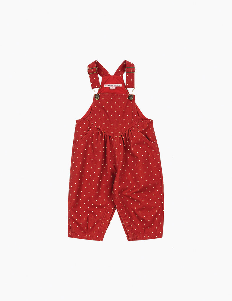 Red polka dot overalls on a white background