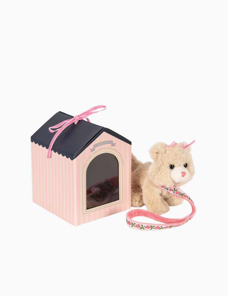 Pink pet house with a teddy bear on a white background