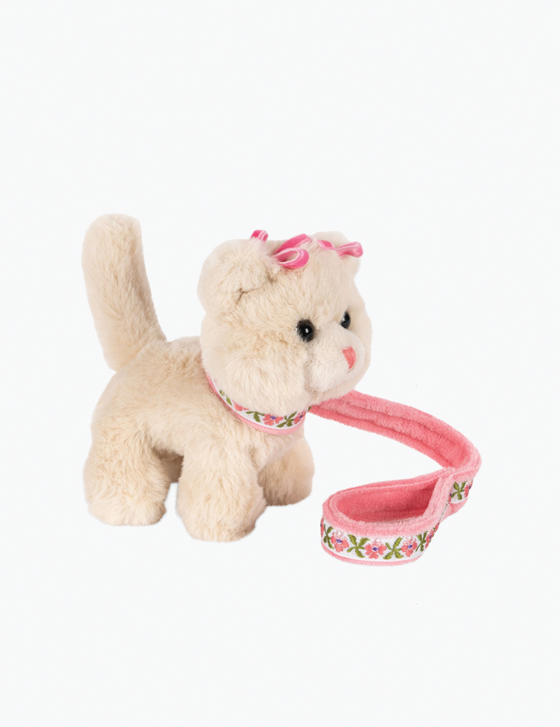 Plush toy cat with a pink collar and bow on a white background