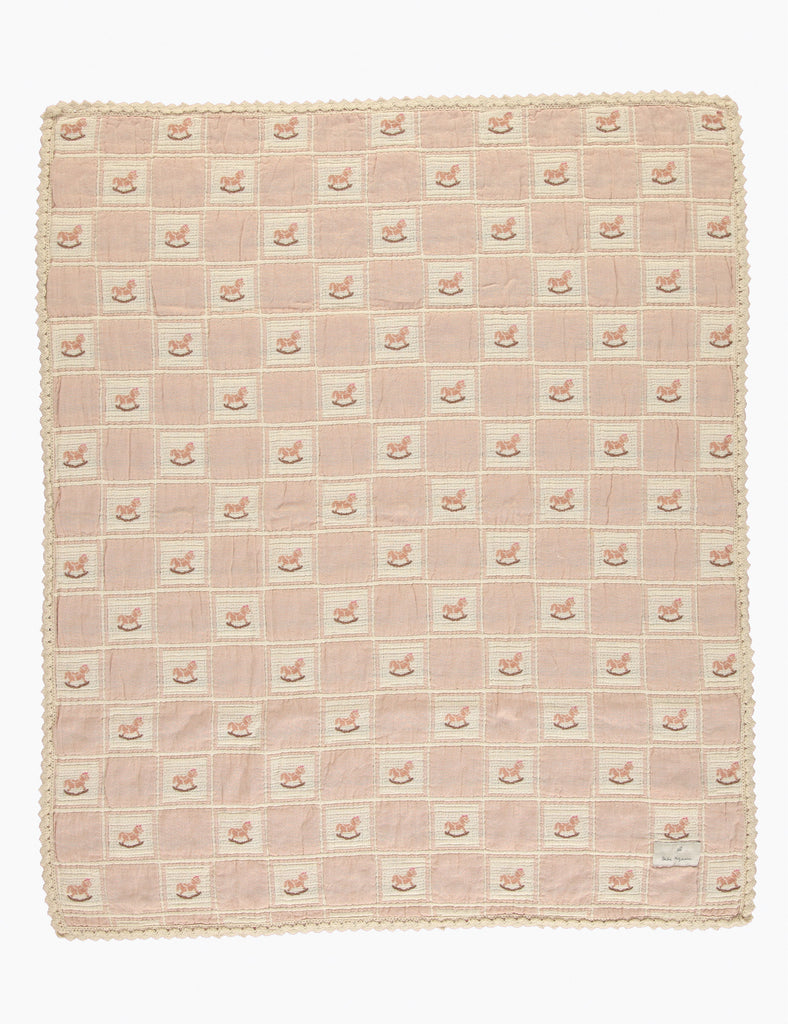 Pink checkered blanket with a textured border on a white background