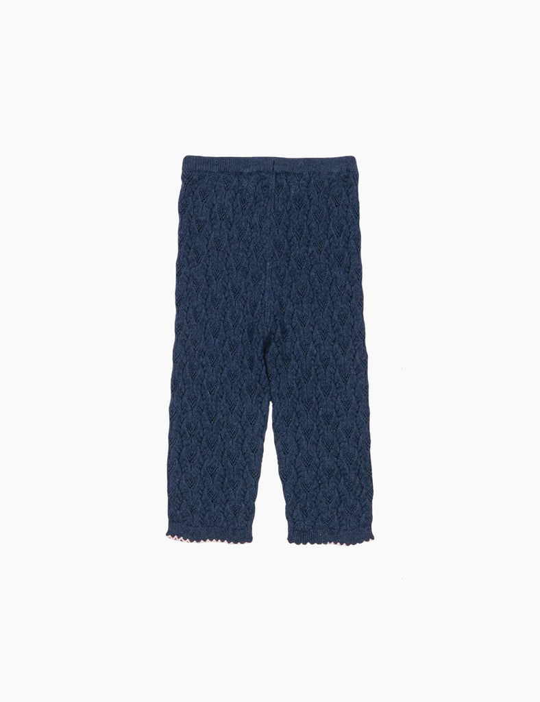 Dark blue textured pants on a white background