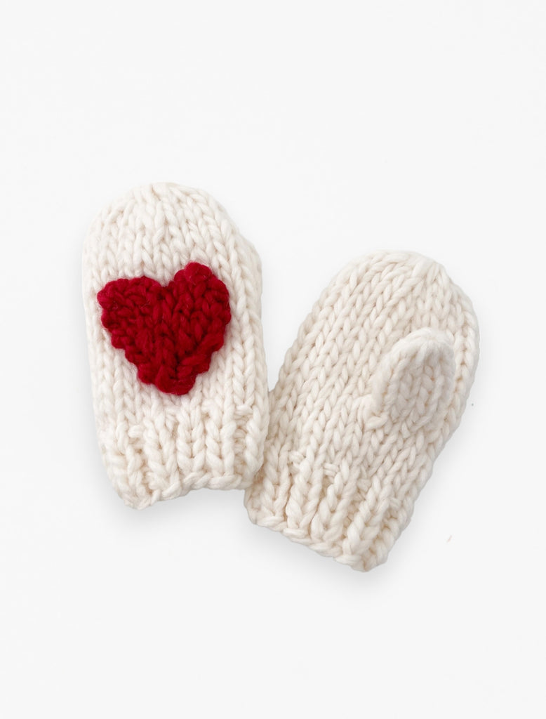 Red Heart Mittens in cream flat lay image.