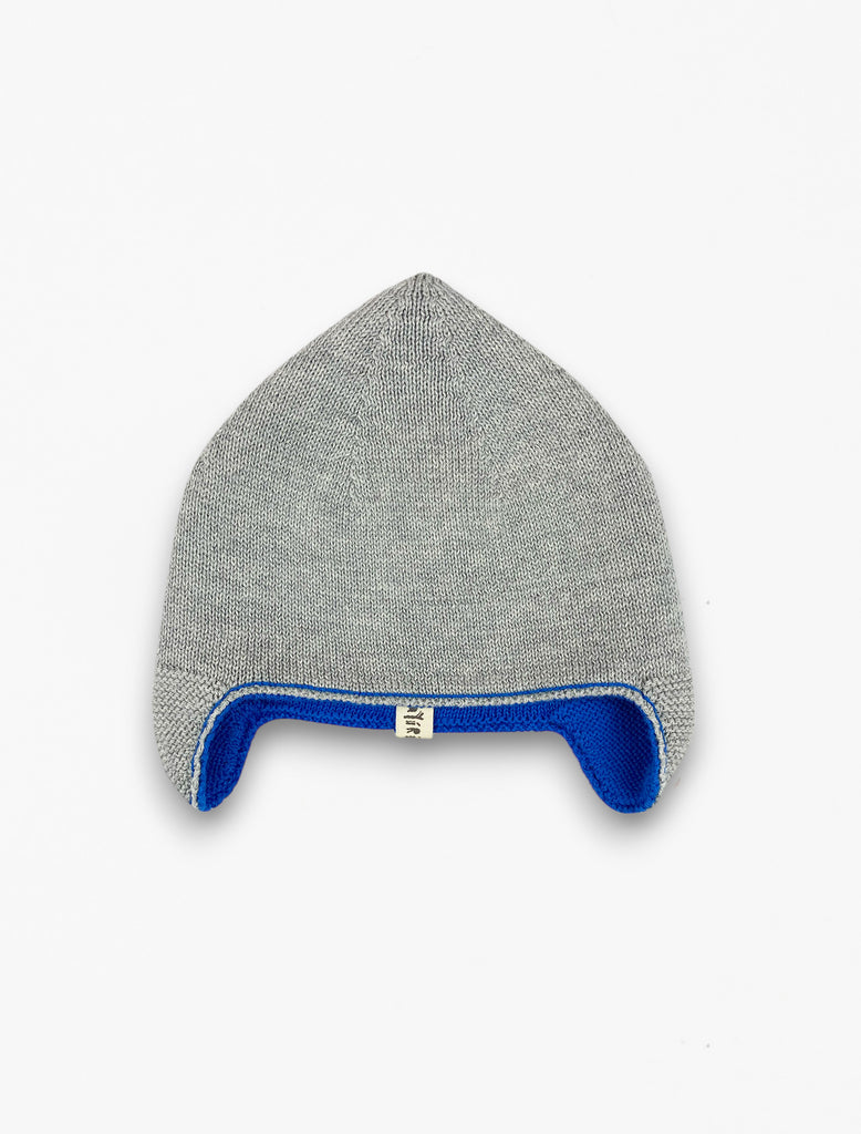 Reversible knitted beanie in galaxy blue flat lay image.