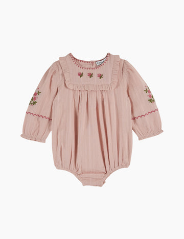 Pink baby romper with floral embroidery on a white background