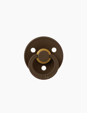 Image of a pacifier in brown on a white background.