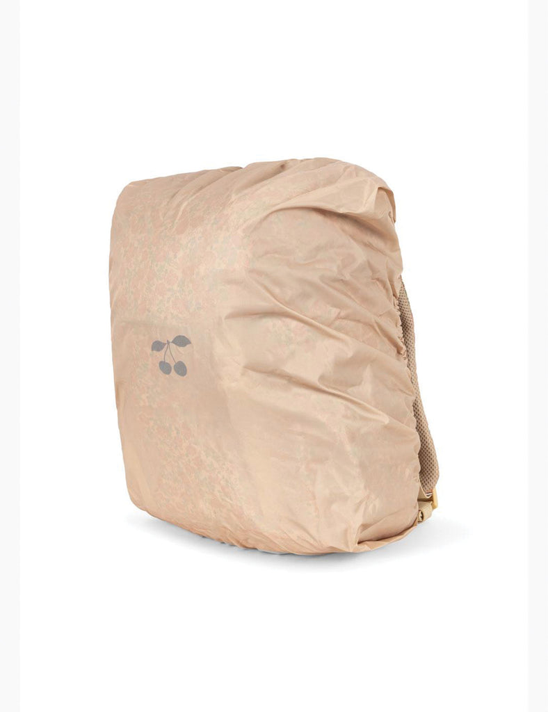 Beige travel pack with a visible brand logo on a white background