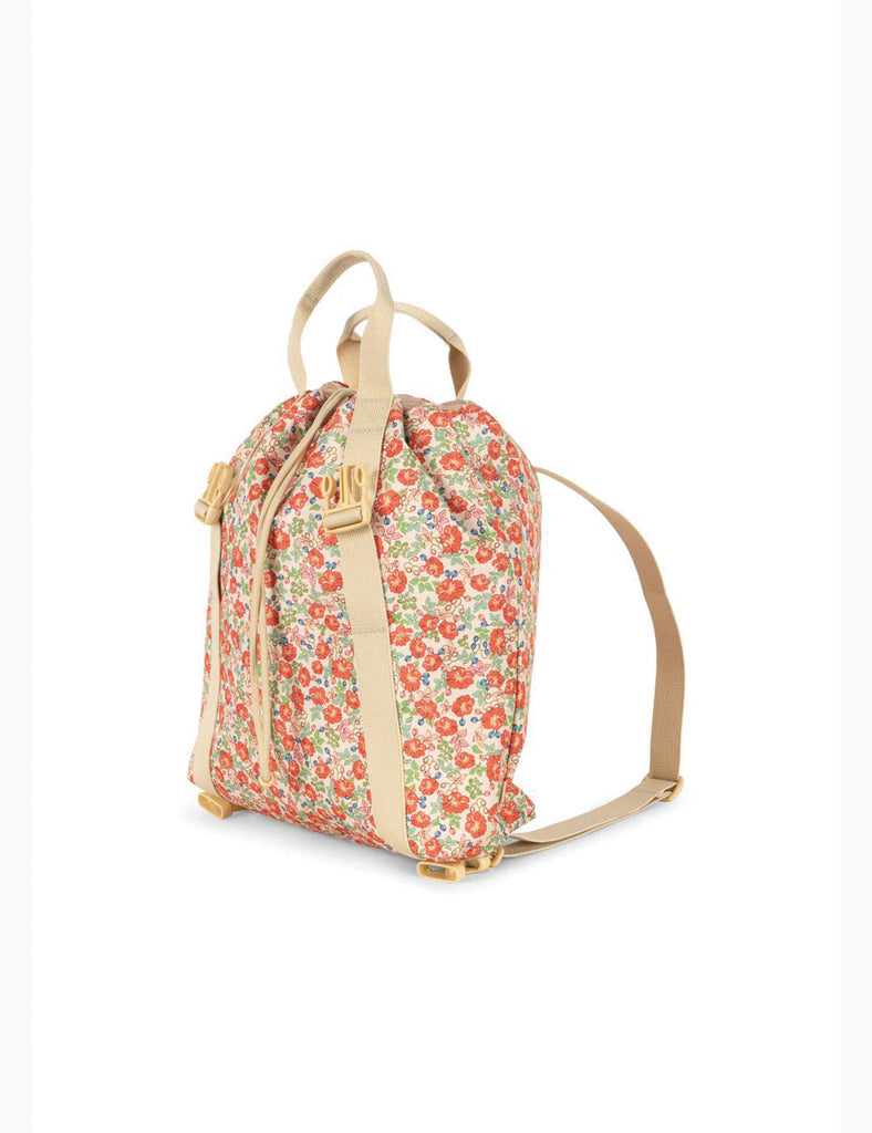 Floral patterned backpack with beige straps on a white background