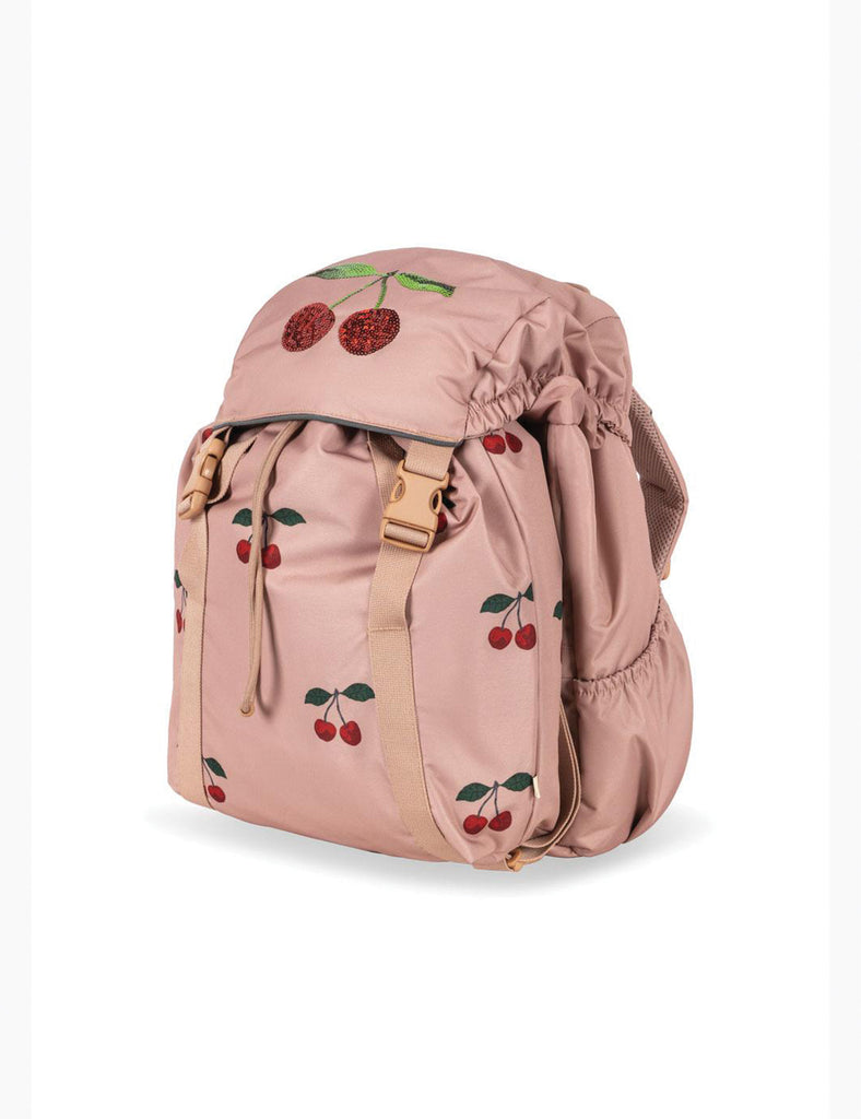Pink backpack with cherry designs on a white background