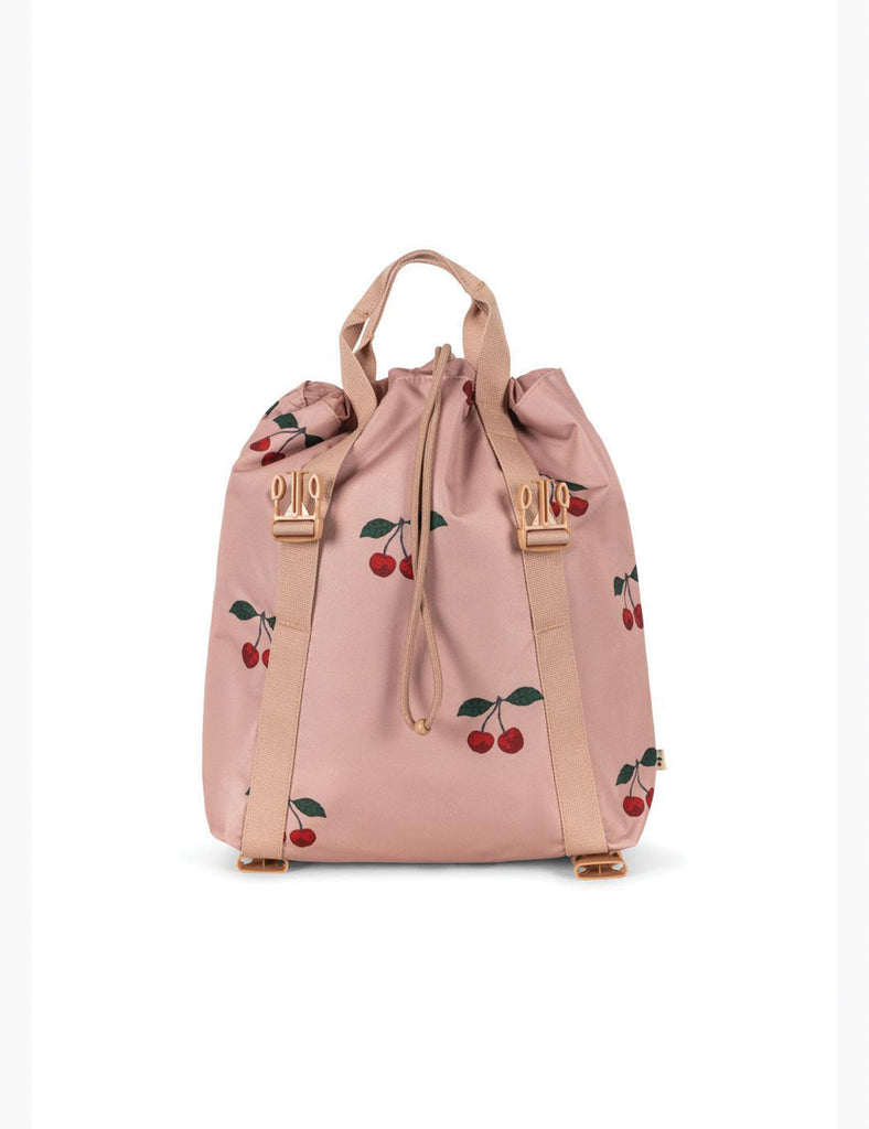 Pink backpack with cherry designs on a white background