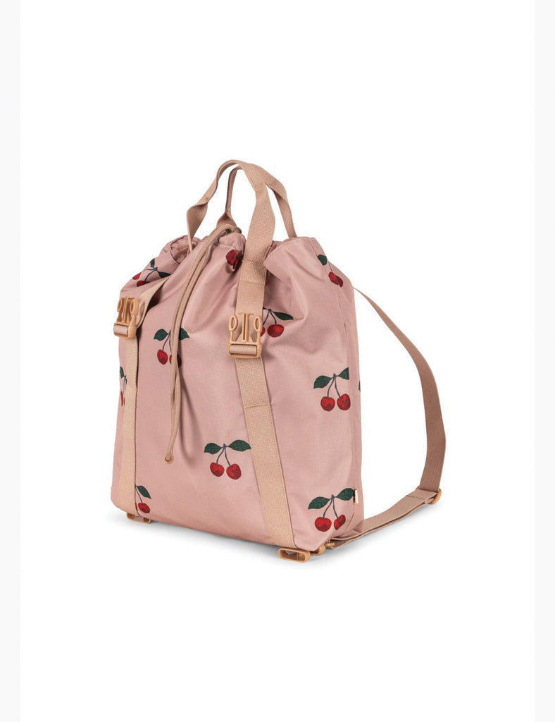 Pink backpack with cherry pattern on a white background