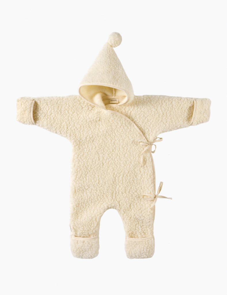 Cream-colored baby snowsuit with hood on a white background