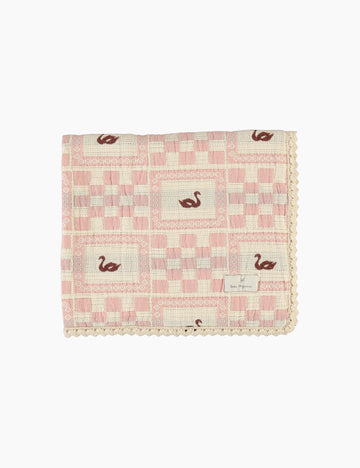 Pink checkered blanket with swan pattern on a white background