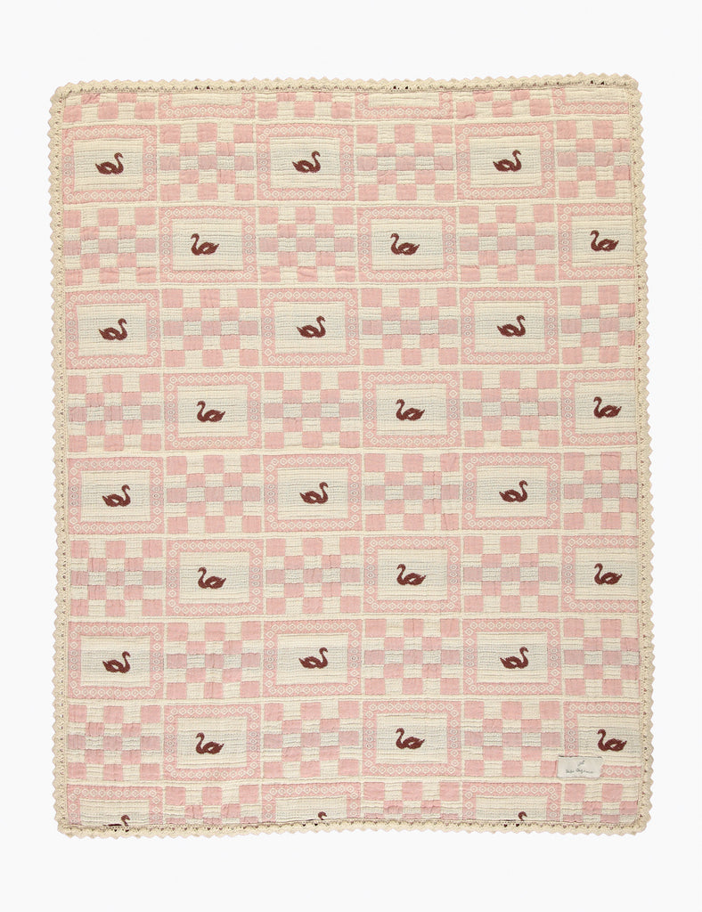 Pink and white checkered blanket with flamingo pattern on a white background