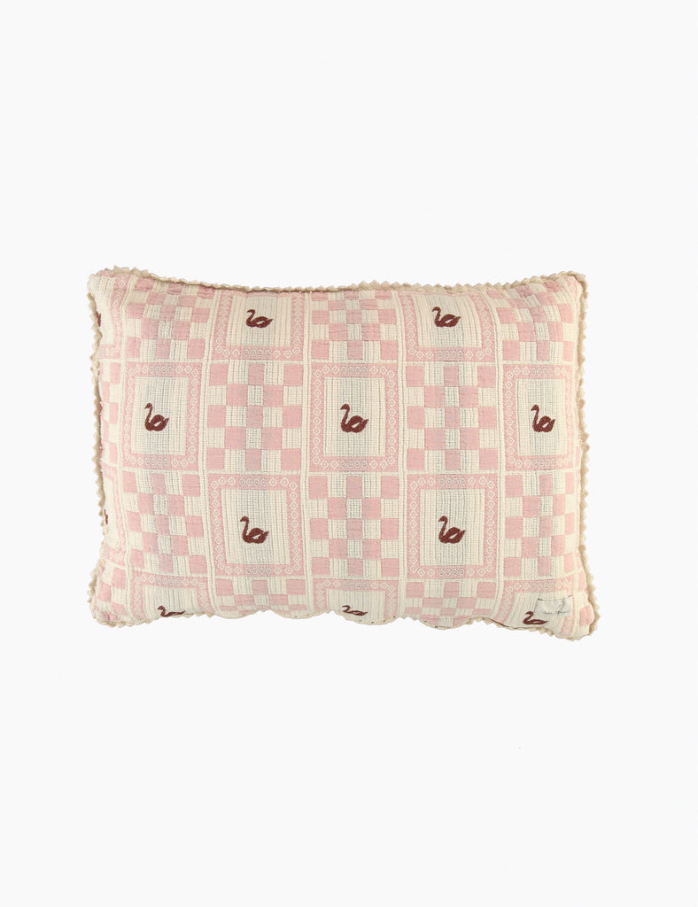 Checkered pillow with swan pattern on a white background