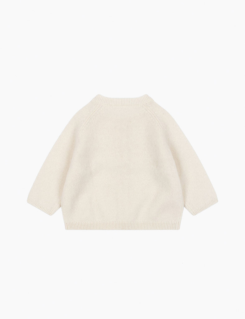 Beige sweater on a white background
