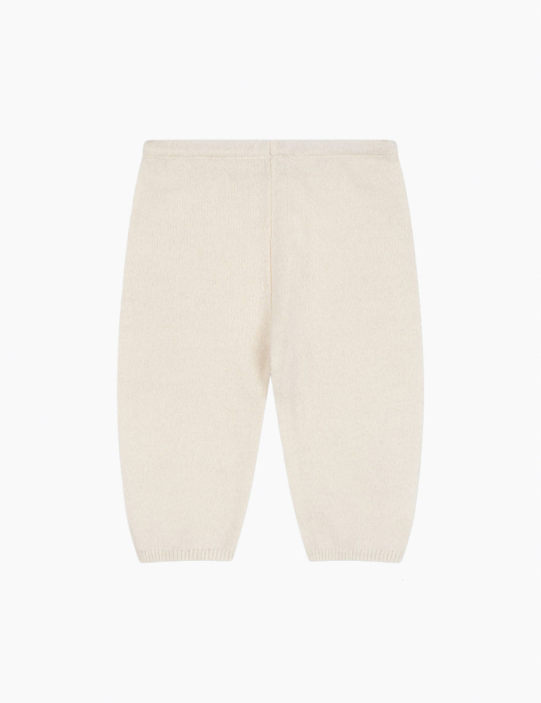 Soft off white baby pants on a white background