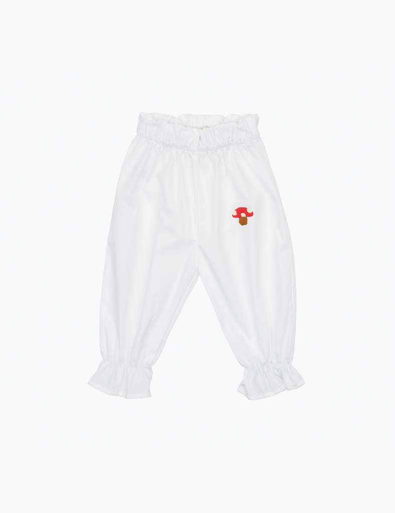 White pants with a small red embroidered mushroom design on a white background