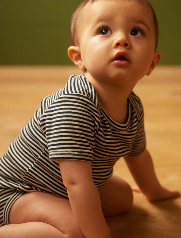 Image of Short Sleeve Bodysuit in Navy Stripe.Image of Short Sleeve Bodysuit in Navy Stripe.