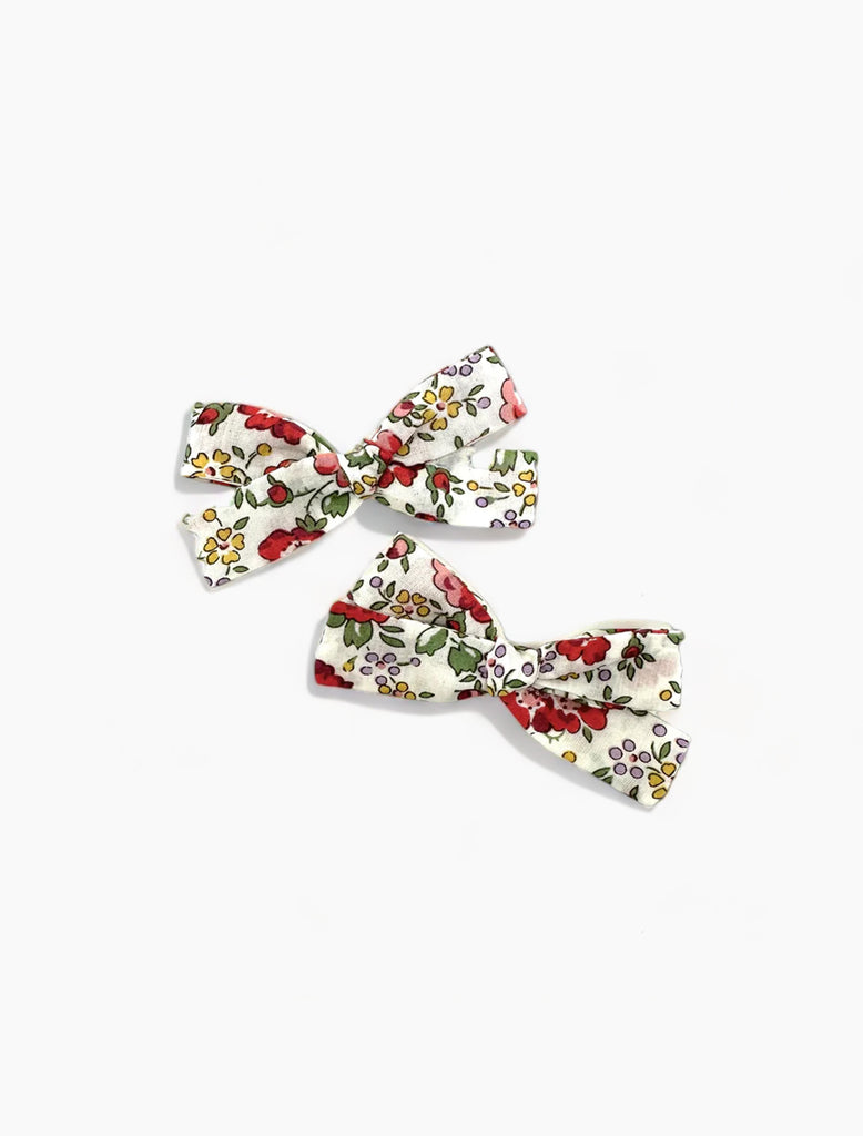 Image of Skinny Pigtail Clips in Liberty Red and Cream floral.