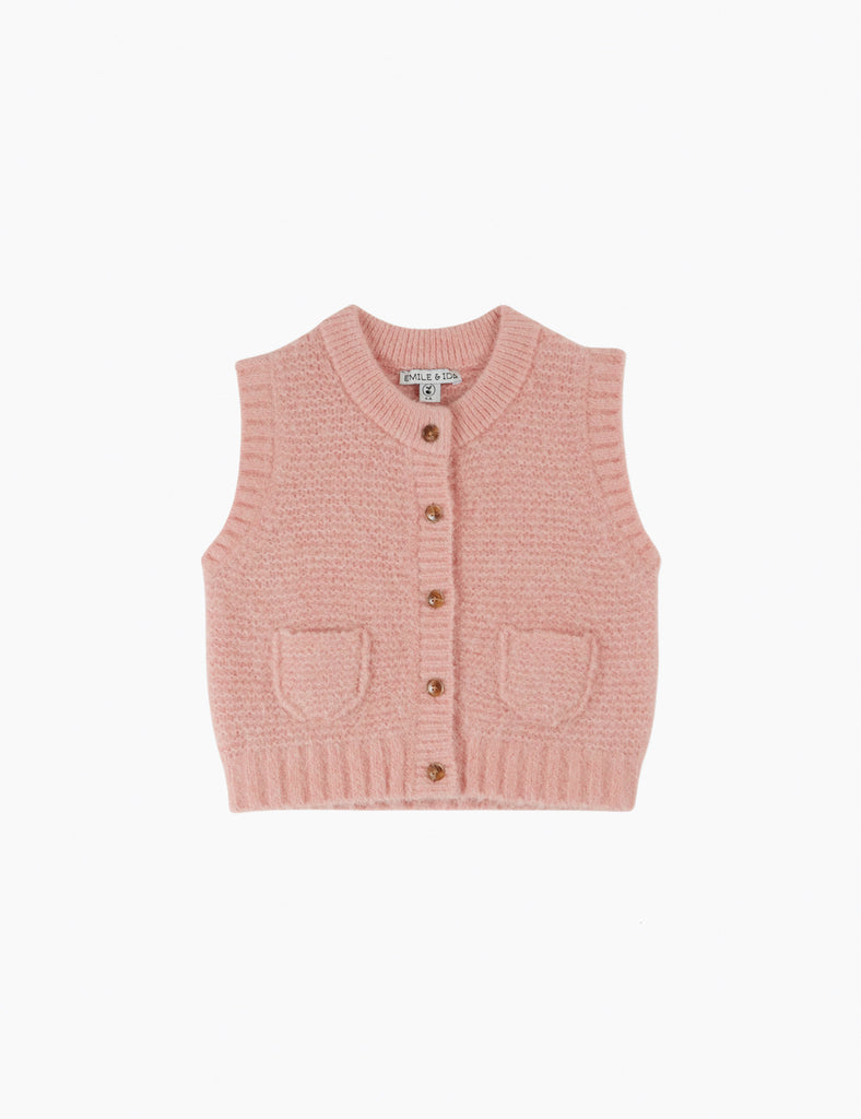 Pink knitted vest with button details on a white background