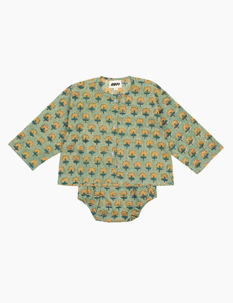 Baby outfit with long-sleeve shirt and onesie featuring a pattern on a white background