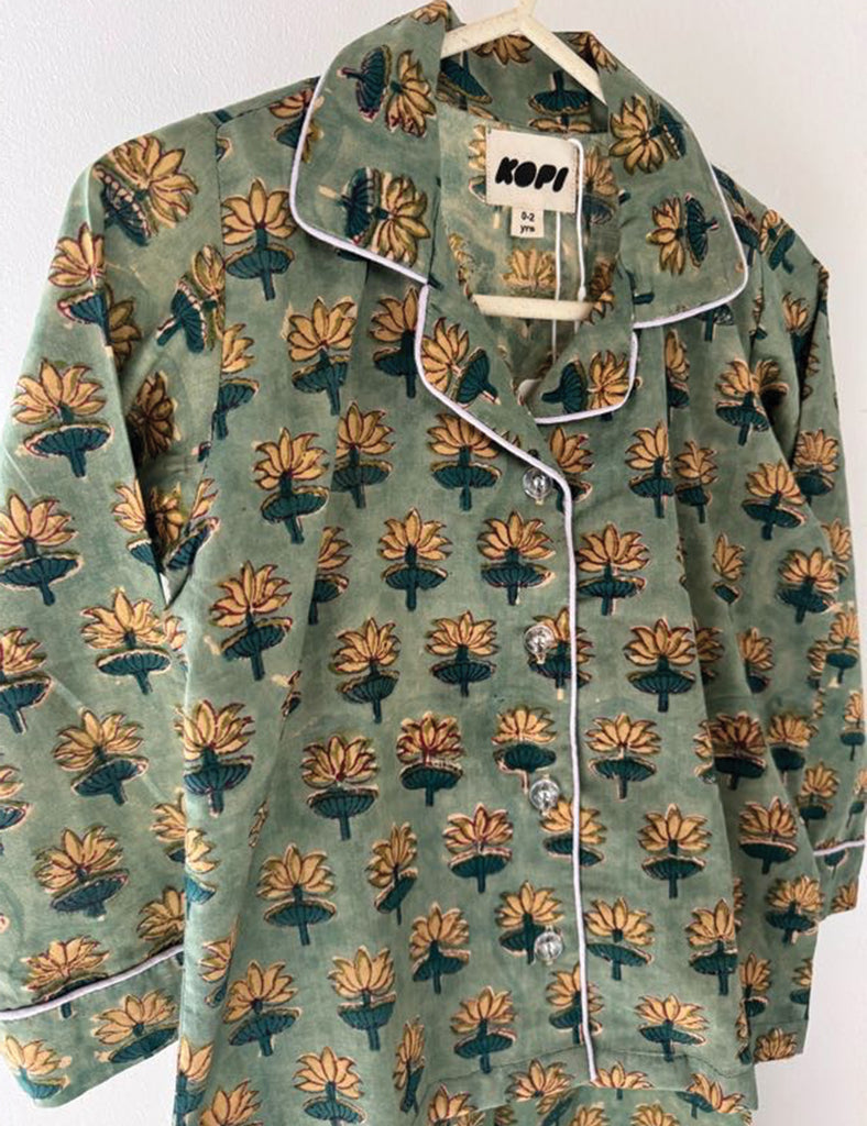 Floral patterned pajama set on a hanger with 'Kopi' label.