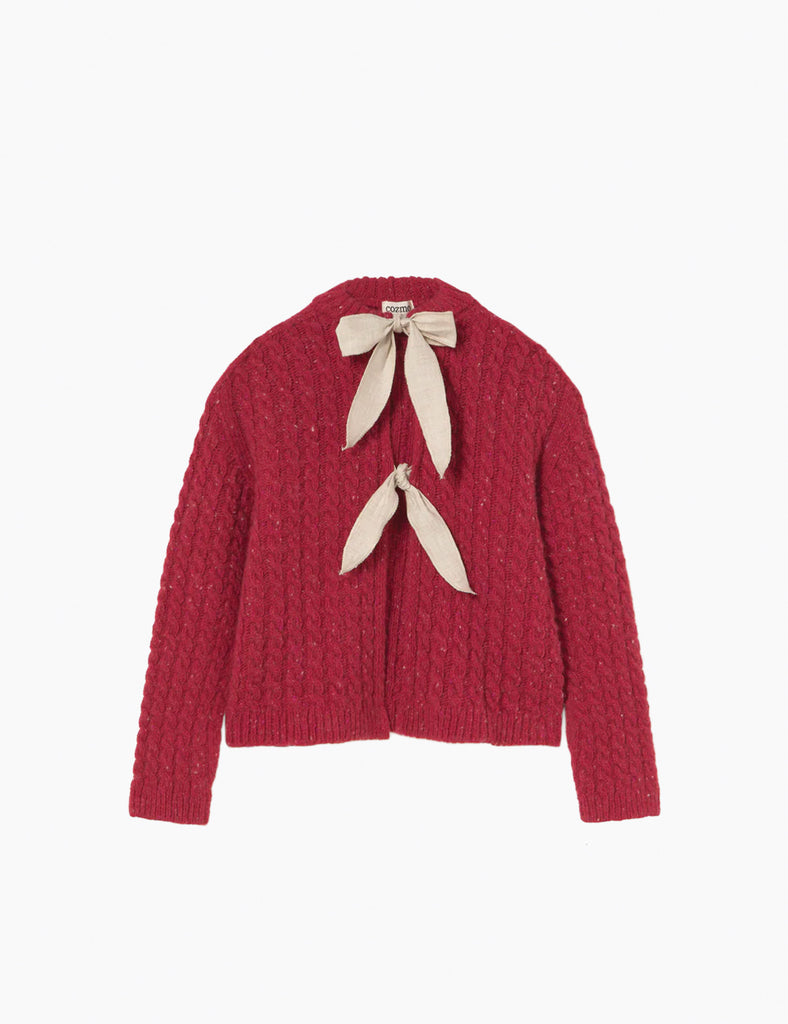 Red knitted cardigan with beige ribbon on a white background